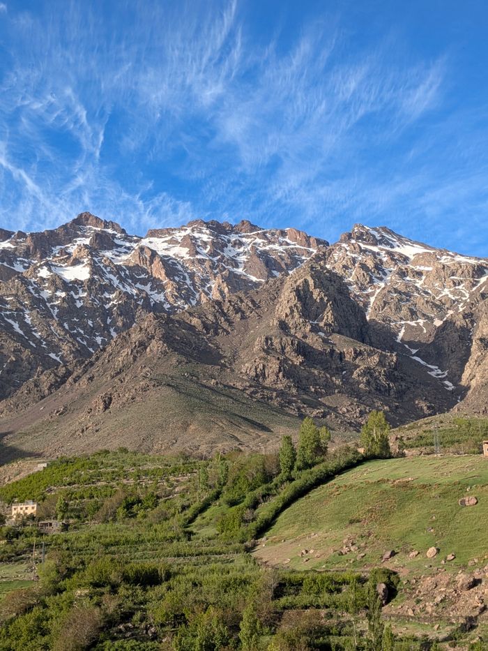 Home Breathtaking landscape of the Atlas Mountains with clear blue skies in Tachdirt, Morocco.